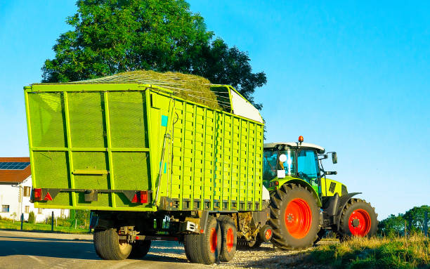 istock Tractor with trailer full of hay Bourgogne Franche Comte 1219786909