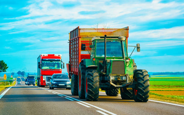 istock Agricultural tractor at highway road in Poland 1219787040
