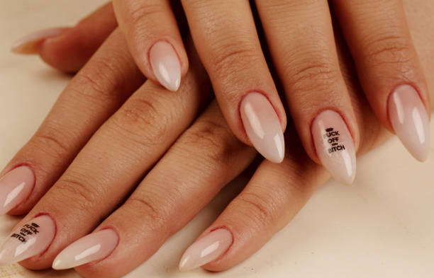 istock Close-up nail polish and long nails. Perfect manicure. 1219790910