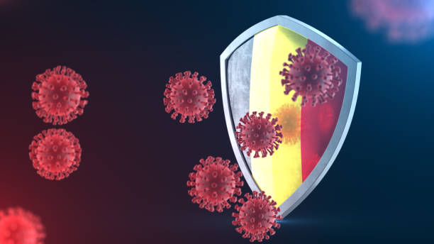 escudo de seguridad como concepto de protección antivirus. barrera de seguridad coronavirus sars-cov-2. escudo de acero brillante pintado como bandera nacional belga defenderse de las células, fuente de la enfermedad de covid-19. renderizado 3d - belgium belgian flag flag shield fotografías e imágenes de stock