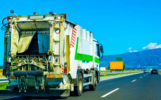 istock Truck carrying trailer with garbage container in Slovenia 1219791786