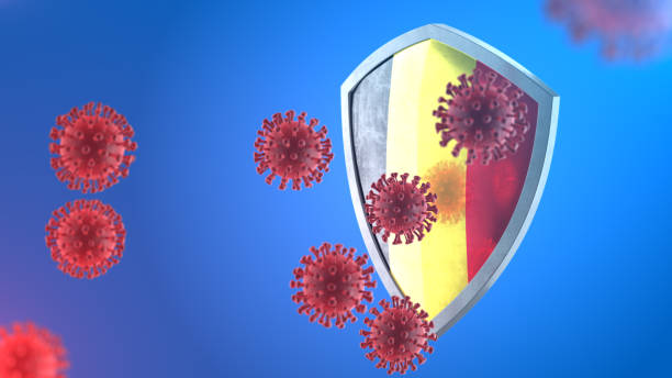 security shield as virus protection concept. coronavirus sars-cov-2 safety barrier. shiny steel shield painted as belgian national flag defend against cells, source of covid-19 disease. 3d rendering - belgium belgian flag flag shield imagens e fotografias de stock