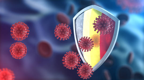 escudo de seguridad como concepto de protección antivirus. barrera de seguridad coronavirus sars-cov-2. escudo de acero brillante pintado como bandera nacional belga defenderse de las células, fuente de la enfermedad de covid-19. renderizado 3d - belgium belgian flag flag shield fotografías e imágenes de stock