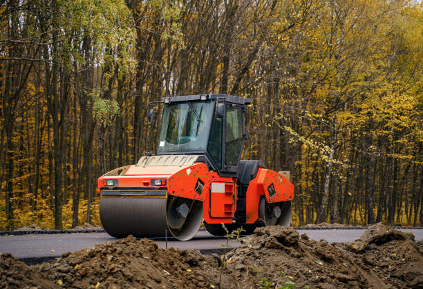 istock Road repair, compactor lays asphalt. 1219792518