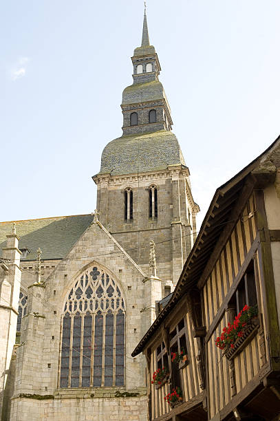 istock Dinan (Brittany, France) - Old half-timbered houses and church 121979479