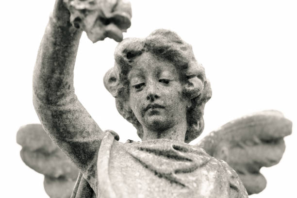 istock Angel, old statue of angle, white background with copy space 1219795122