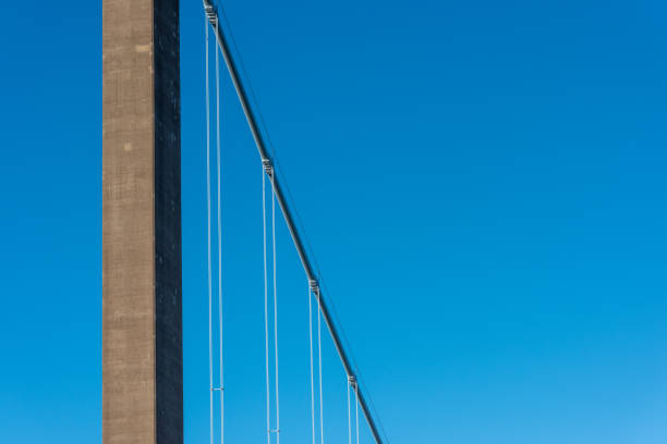Cables and tower of a suspension bridge.