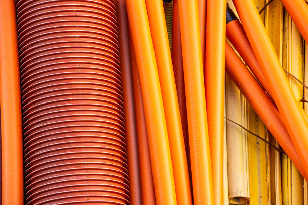 istock Plastic pipes in black, red, orange and yellow. 1219797259