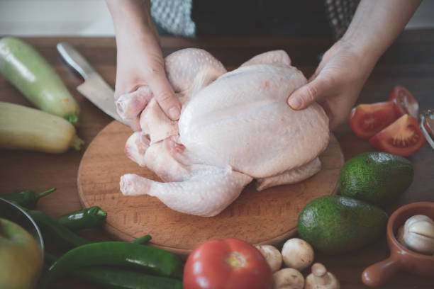 istock woman in the kitchen preparing food 1219799634