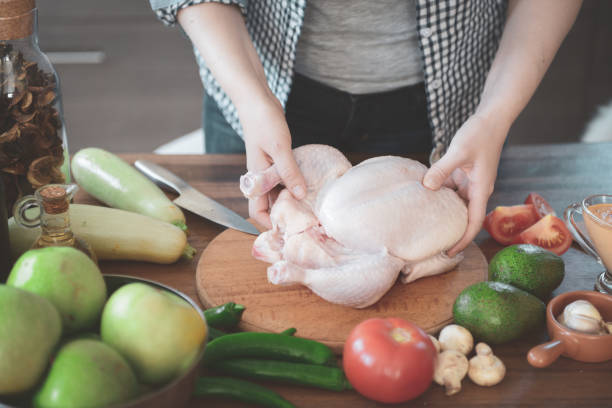 istock woman in the kitchen preparing food 1219799673