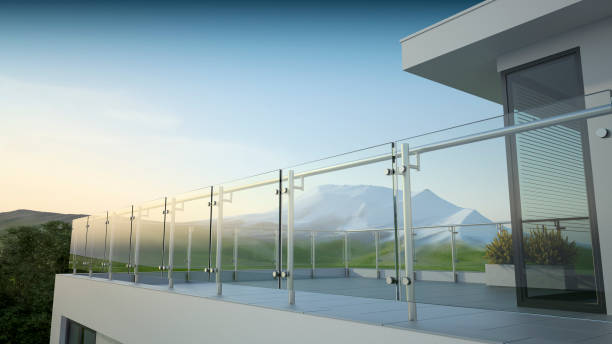 istock Modern stainless steel railing with glass panel and landscape mountain 1219800585
