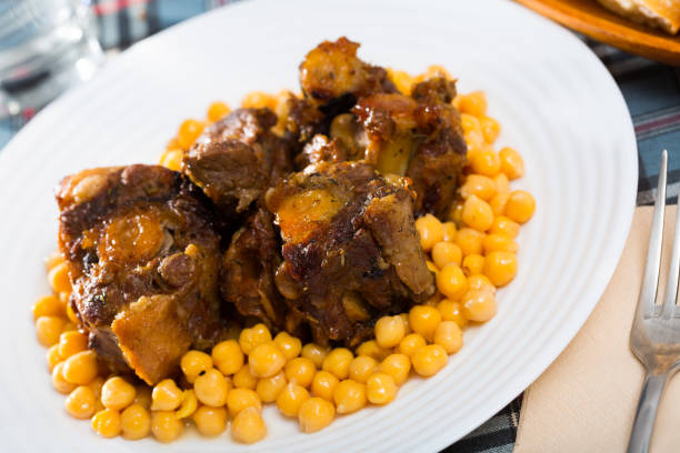 istock Braised oxtails with chickpeas on a white plate 1219800633