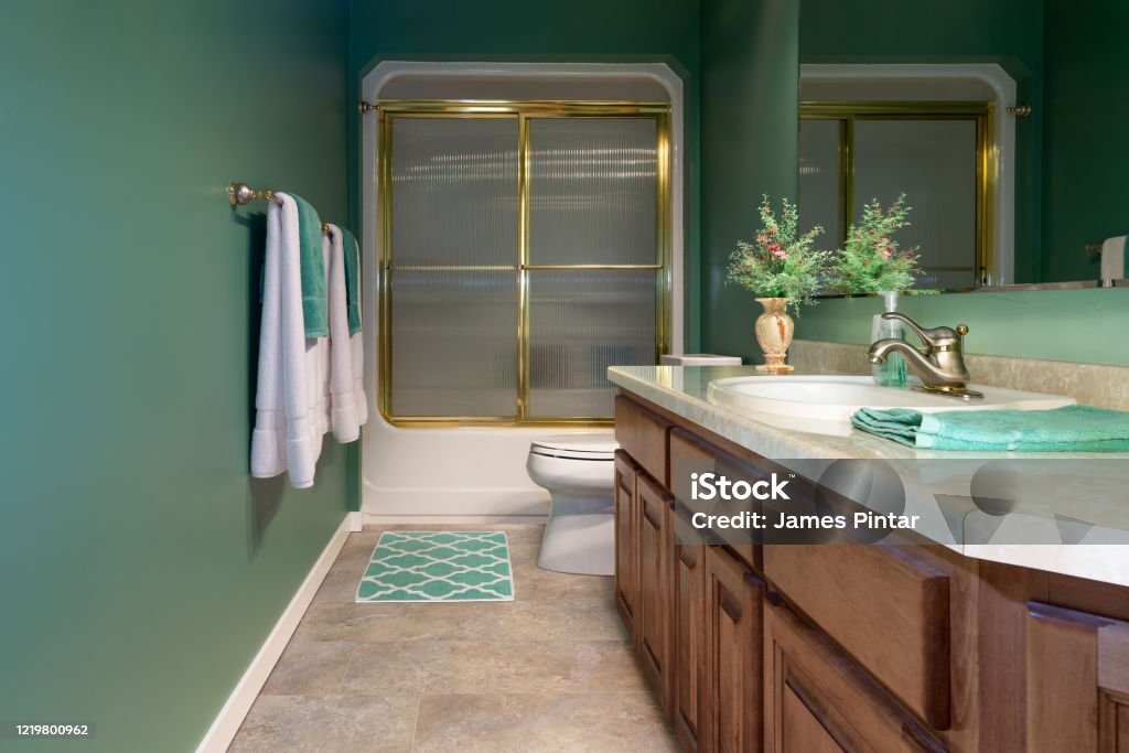 Remodeled Home Bathroom Home guest bathroom that has been remodeled with luxury vinyl tile flooring. Bathroom Stock Photo