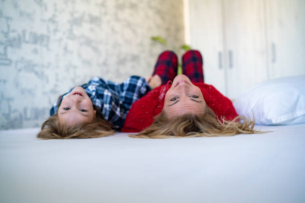 istock Mom and son upside down in bed 1219808590