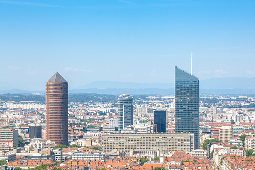 Picture of he landscape of Lyon, France, from above, on the Fourviere hill during a sunny afternoon. Major Lyon skyscrapers and landmarks like the narrow streets of the Old Lyon and the Saone river are visible