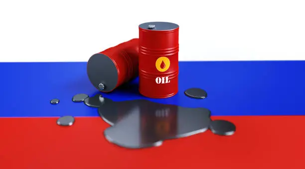 Red oil drums sitting on Russian flag. Horizontal composition with copy space. Russian oil industry concept.