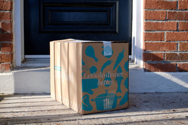 Food stocking east End Montreal during pandemic Montreal, Canada. April 14, 2020 .Prepared meal delivery box from company Goodfood left on doorstep of house goodfood stock pictures, royalty-free photos & images
