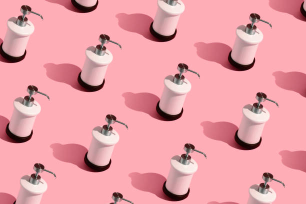 istock Dispenser for liquid soap on a pink background. 1219817214