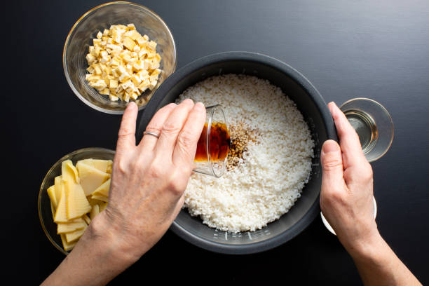 Japanese home cooking, bamboo shoot rice (rice cooked). In Japanese, it is Takenoko Gohan. Bamboo shoot rice is
Take the bamboo shoots from the mountain, remove the lye with rice bran, cut the bamboo shoots and put them in a rice cooker to cook with rice. zanthoxylum stock pictures, royalty-free photos & images
