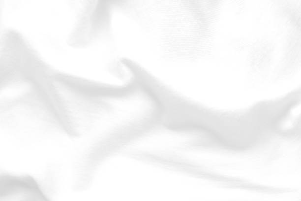 istock White cloth background abstract. Fabric is wrinkled and sofe wave. Material are used in textile assembly. detail texture of pattern design, elegance with free space copy for backdrop or wallpaper. 1219821410