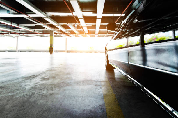 istock Black car parking in garage 1219823827