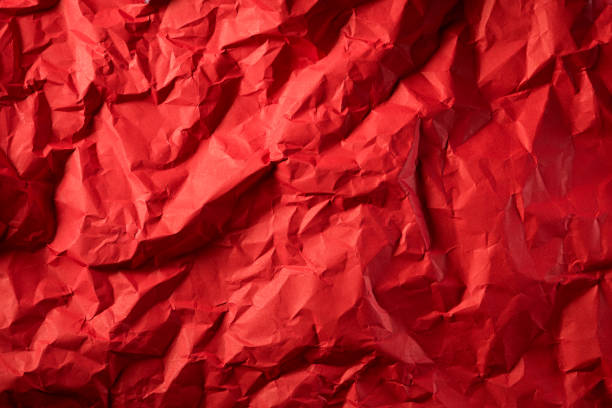 istock Texture of crumpled red paper. Creative vintage for design background. 1219823844