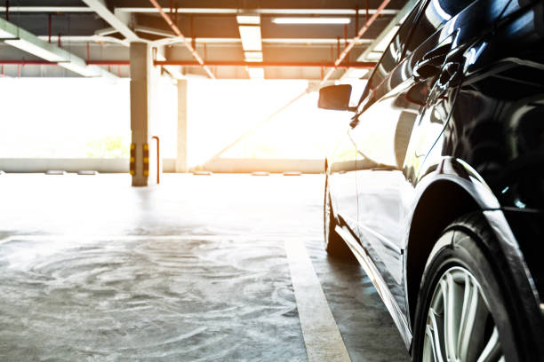 istock Black car parking in garage 1219823853