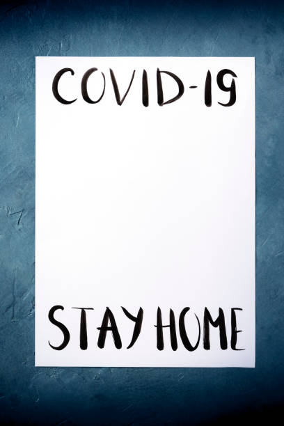 istock Covid-19 design template with the Stay at home message in handwriting and place for data 1219832904