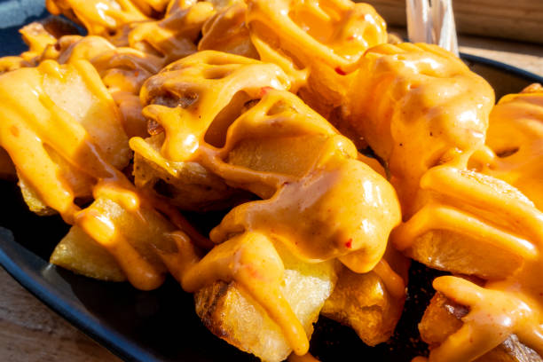 istock Potatoes bravas, typical Spanish food. Potato with a spicy willow, a close-up 1219832972