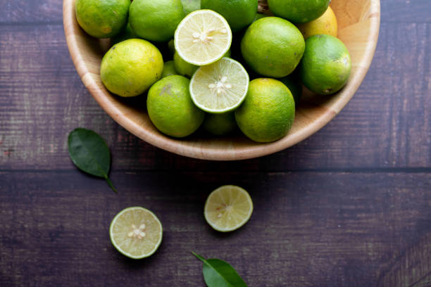 istock kitchen table with fresh lemon on wood plate. 1219833812