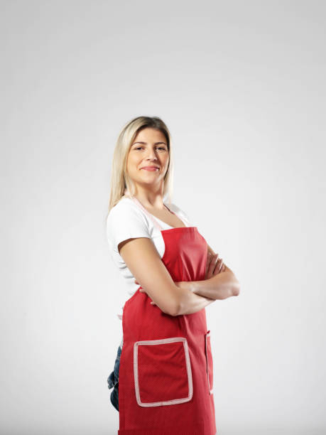 домохозяйка - front view female isolated on red happiness стоковые фото и изображения