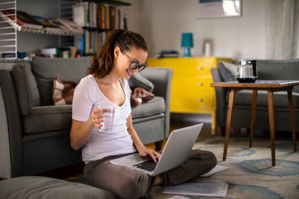istock Young woman working from home 1219833866