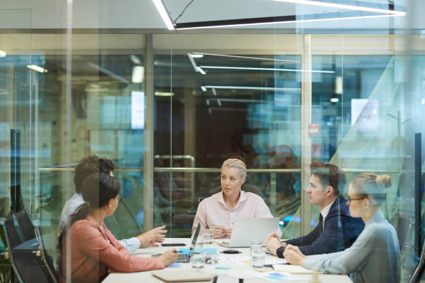 istock Business meeting behind the glass wall 1219834527