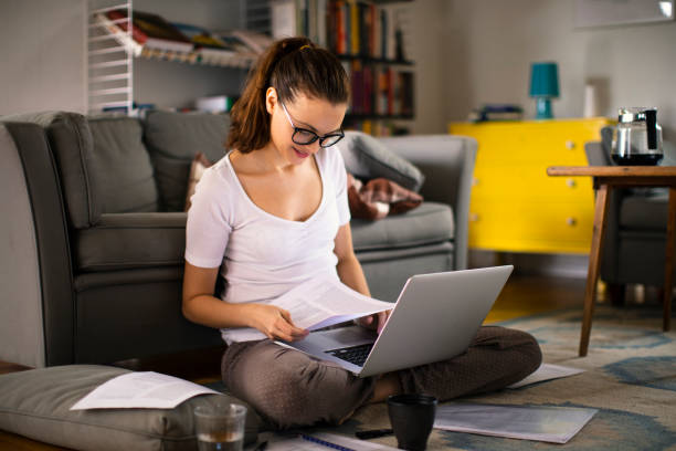 istock Young woman working from home 1219835454