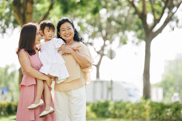 istock Family enjoying walk in park 1219837170