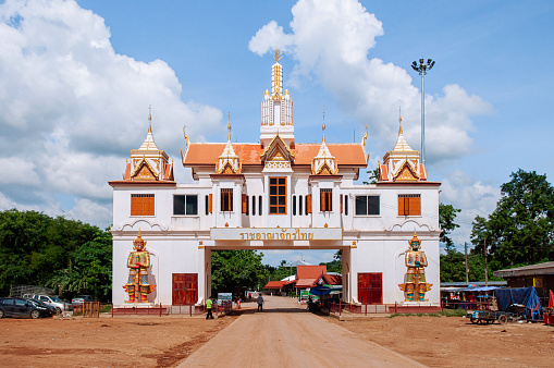 MAY 30, 2018 Sa Kaeo, Thailand - Immigration gate of Khlong Hat, Sa Keao - Thailand  or Phnomdei border, Sampov Lun - Cambodia with dirt road. Words written on gate is \