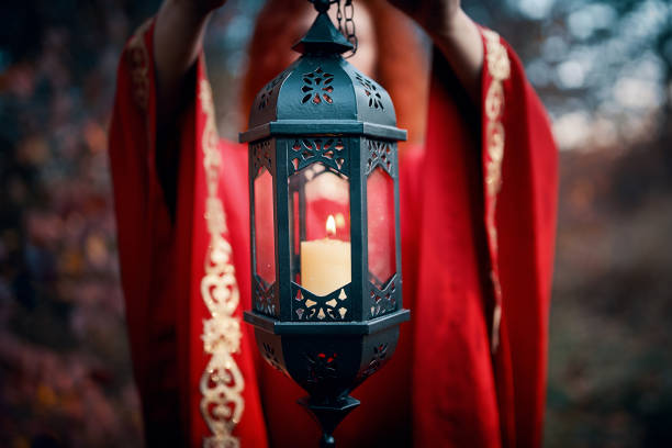 istock Woman holding a lantern with a candle. 1219838016