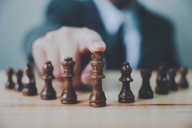 istock Businessman with chess board game. Plan strategy and tactic concept 1219841122