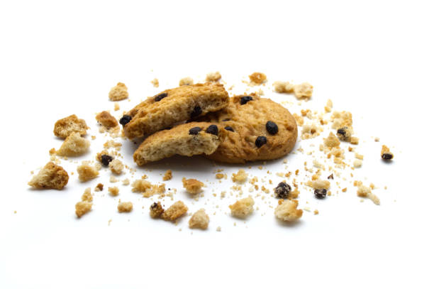 istock Chocolate chip cookies with cracks and crumbs isolated on white background. Sweet biscuits delicious and crunchy homemade pastry. 1219843268