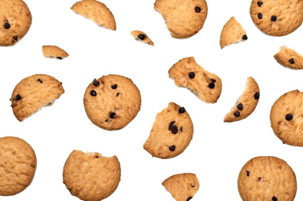 istock Chocolate chip cookies and crumble cracks on white background. Sweet biscuits delicious and crunchy homemade pastry. 1219843980