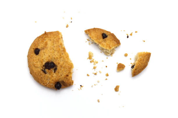 istock Chocolate chip cookies and crumble cracks on white background. Sweet biscuits delicious and crunchy homemade pastry. 1219843984