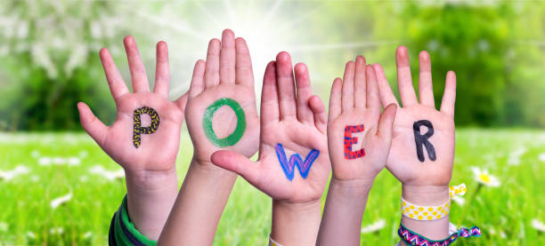 istock Children Hands Building Word Power, Grass Meadow 1219844903