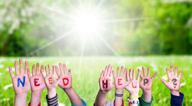 istock Children Hands Building Word Need Help, Grass Meadow 1219844910