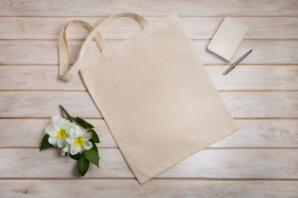 Tote bag mockup with with beige notepad