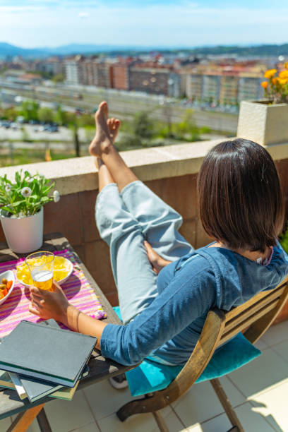 istock Student sunbathing with tapas at the terrace 1219845904