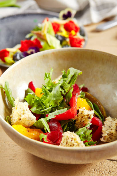 istock Salmon fillet salad in clay plate 1219848138
