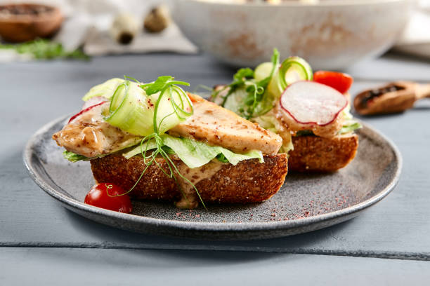 istock Bruschetta with turkey in nut sauce in gray plate 1219848156