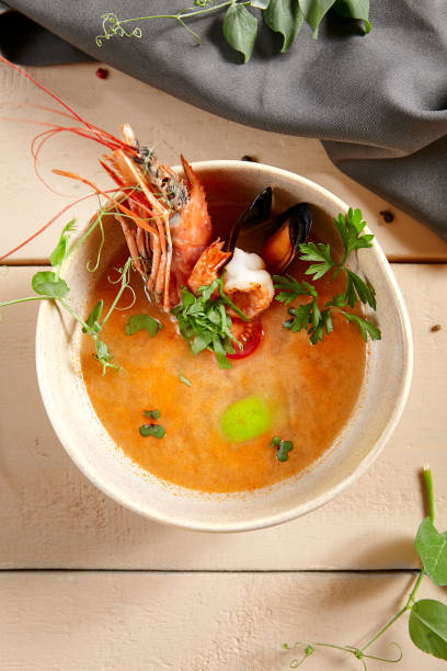 istock Tom yum soup in beige ceramic bowl top view 1219848199