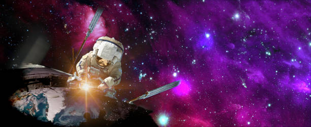 istock Astronaut in outer space over the planet Earth repairs light. Elements of this image furnished by NASA. 1219849655