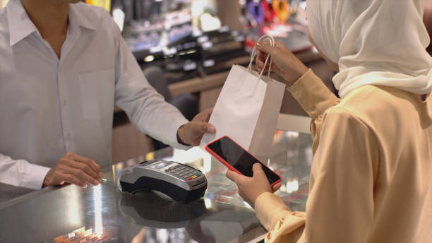 istock Asian Muslim Woman Using Contactless Payment 1219850283